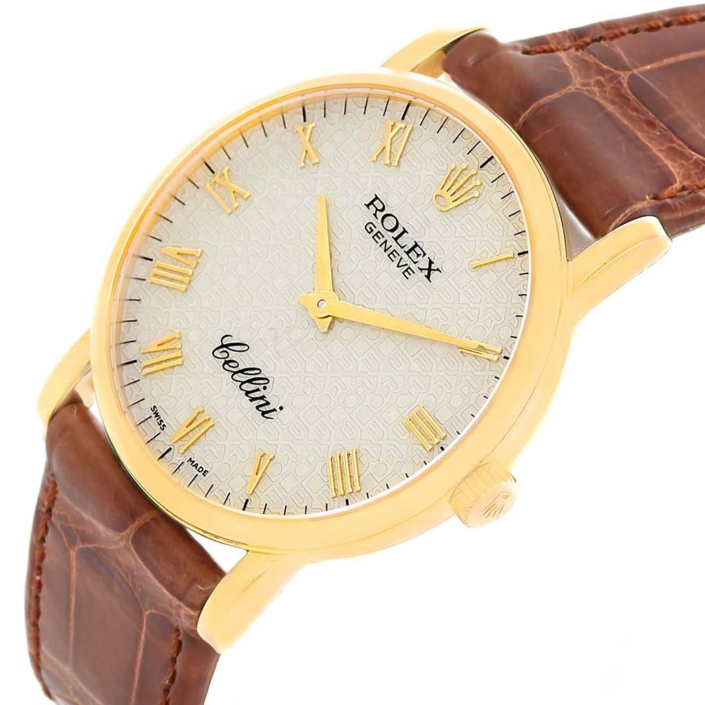 This image shows a close-up of a Rolex Cellini 5115 Men
s Yellow Gold Beige Dial 5115 Men
s Yellow Gold Beige Dial watch face and leather strap, viewed from a slightly tilted angle.
