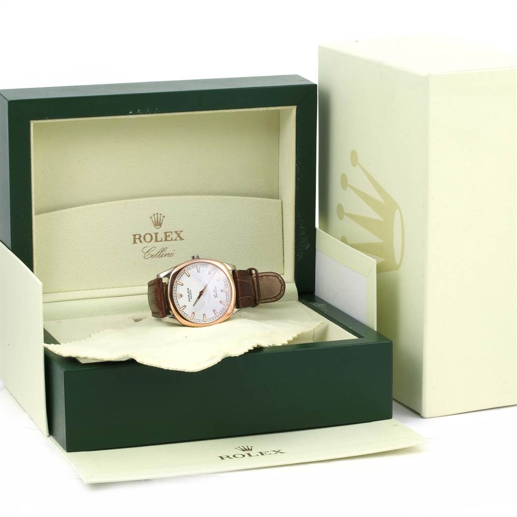 The Rolex Cellini 4243 Men's White Gold White Dial 4243 Men's White Gold White Dial watch is displayed at an angled view within its open box, showing the face, case, and brown leather strap.