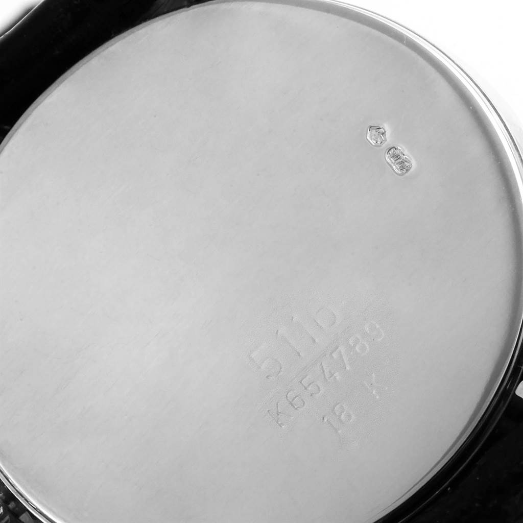 The image shows the case back of a Rolex Cellini 5116 Men
s White Gold Silver Dial 5116 Men
s White Gold Silver Dial watch, angled to display its engravings.