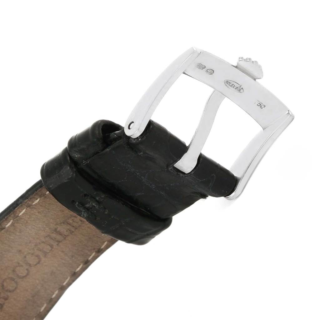 This image shows a close-up of the silver buckle and black leather strap of a Rolex Cellini 5116 Men
s White Gold Silver Dial 5116 Men
s White Gold Silver Dial watch.