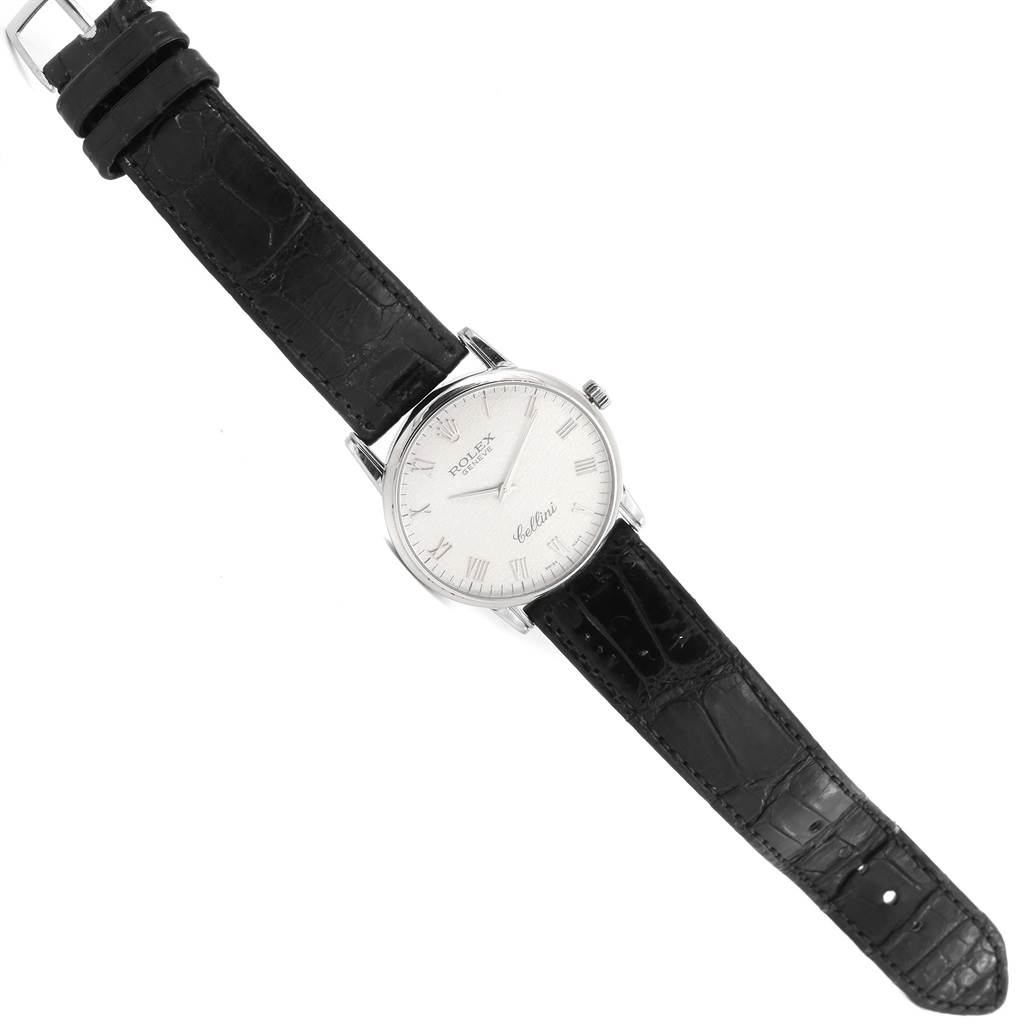 The Rolex Cellini 5116 Men
s White Gold Silver Dial 5116 Men
s White Gold Silver Dial watch is shown from a top-down angle, displaying the dial, case, and black leather strap.