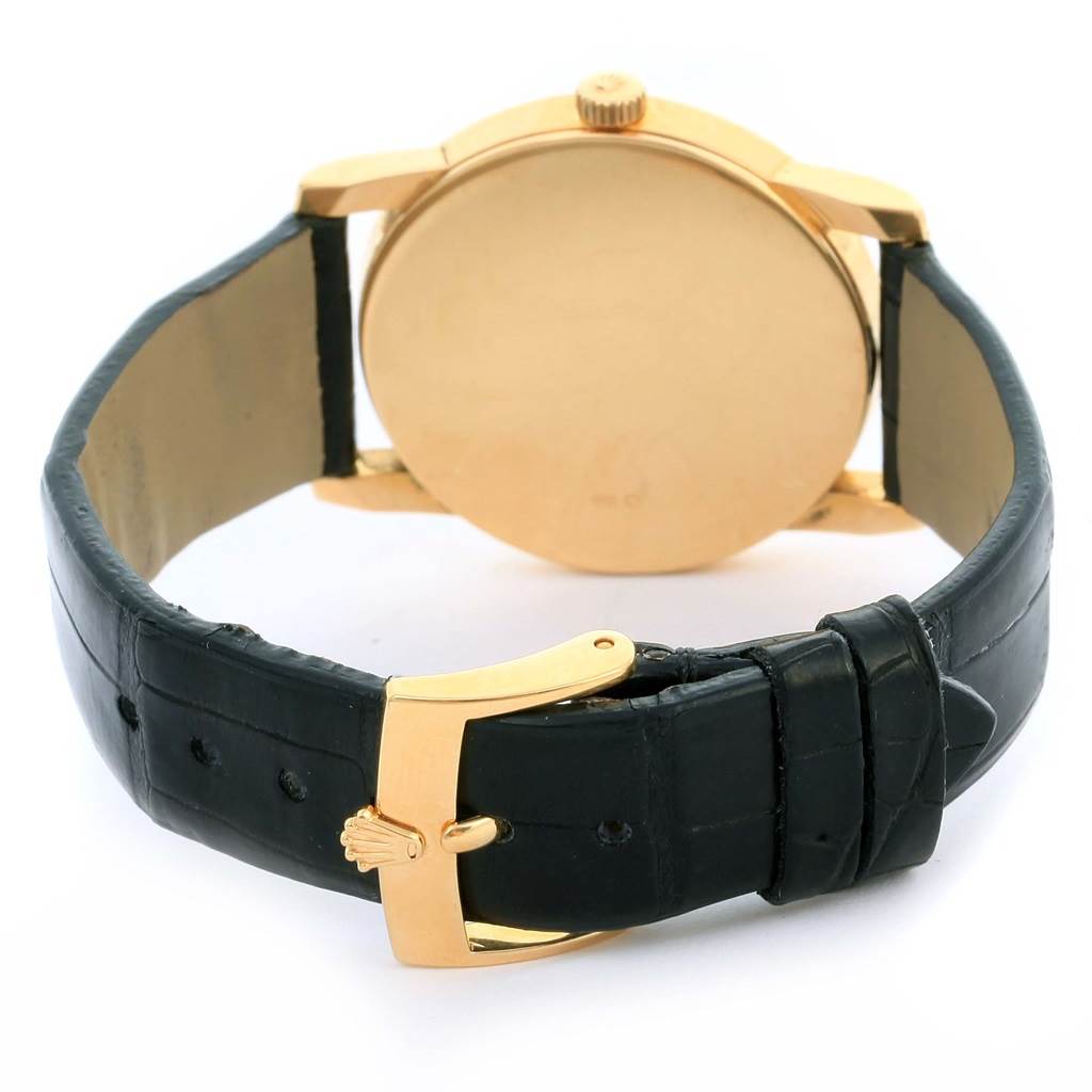 This image shows the back view of a Rolex Cellini 5116 Men's Yellow Gold Silver Dial 5116 Men's Yellow Gold Silver Dial watch, highlighting the case, strap, and buckle.