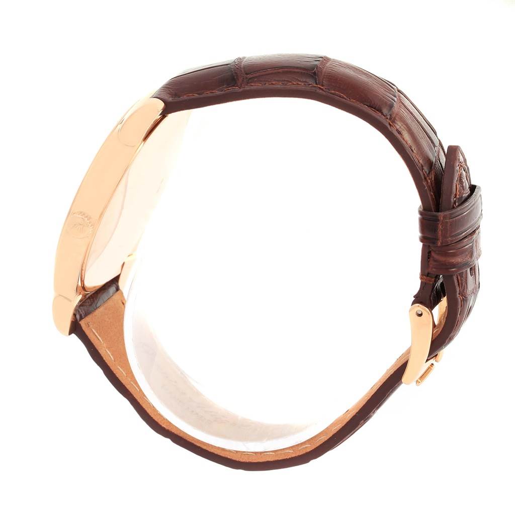 This image shows the side profile of a Rolex Cellini 5330 Men's Rose Gold Grey Dial 5330 Men's Rose Gold Grey Dial watch, highlighting the case and brown leather strap with a gold buckle.