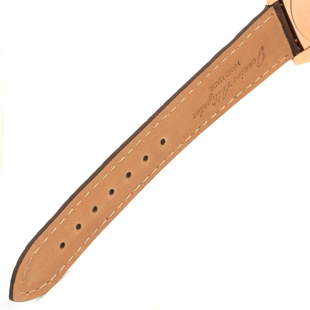 This image shows the leather strap of the Cellini model by Rolex, focused on the holes and stitching details.