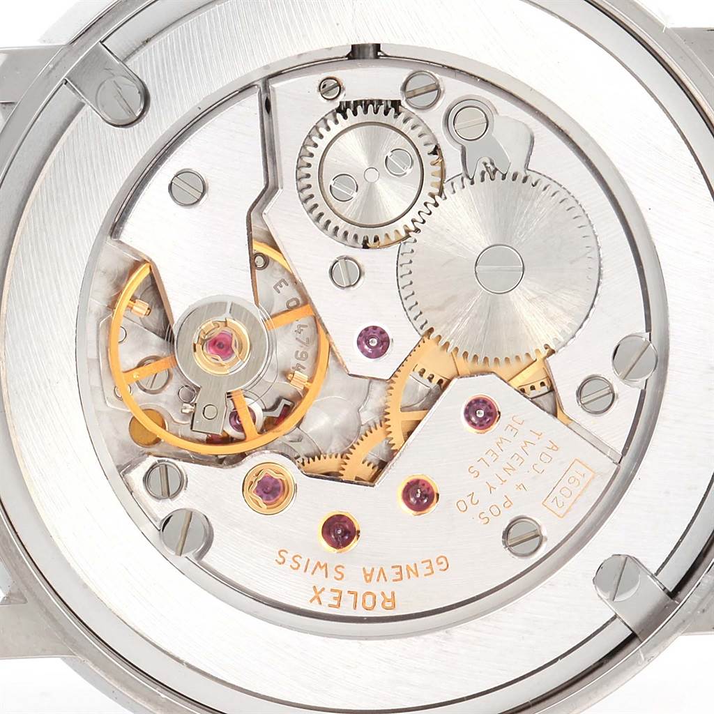 This image shows a close-up of the Rolex Cellini 5115 Men's White Gold Black Dial 5115 Men's White Gold Black Dial watch movement and internal gears.