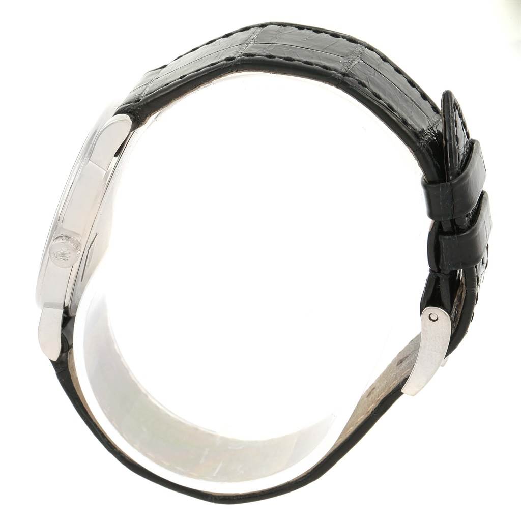 The Rolex Cellini 5115 Men's White Gold Black Dial 5115 Men's White Gold Black Dial watch is shown from a side angle, displaying its black leather strap and case profile.