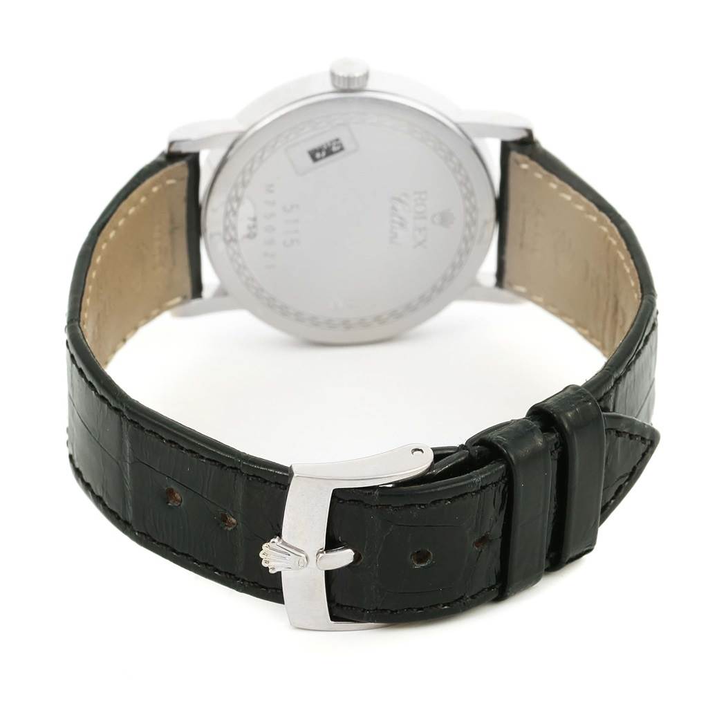 The image shows the back view of a Rolex Cellini 5115 Men's White Gold Black Dial 5115 Men's White Gold Black Dial watch, highlighting the case back and black leather strap with a clasp.