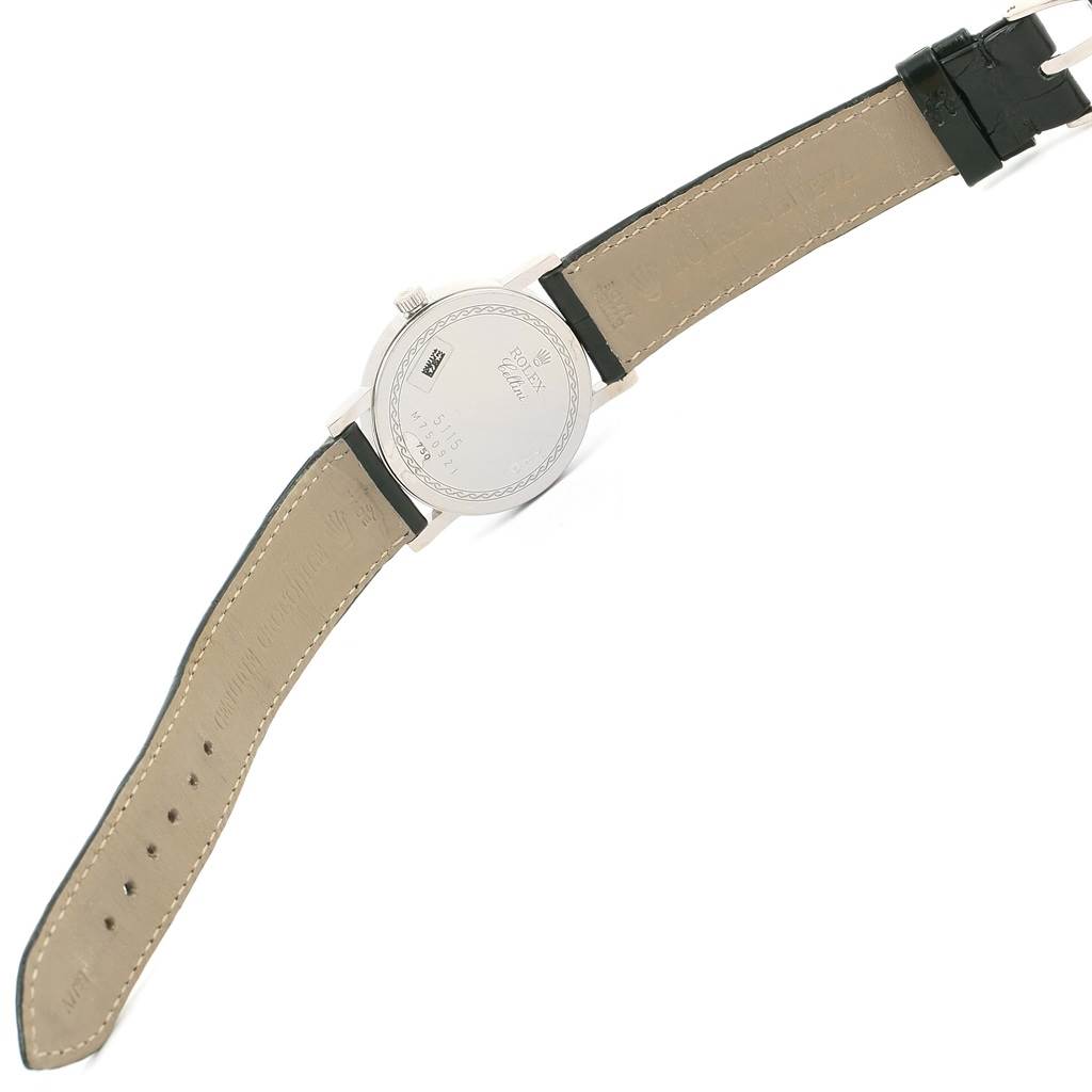 The image shows the back side of a Rolex Cellini 5115 Men's White Gold Black Dial 5115 Men's White Gold Black Dial watch with its leather strap fully extended.