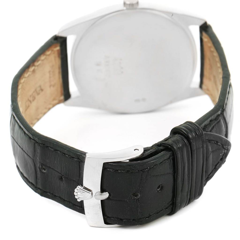 The image shows the back of a Rolex Cellini 4233 Men's White Gold Black Dial 4233 Men's White Gold Black Dial watch with a black leather strap and a stainless steel buckle.