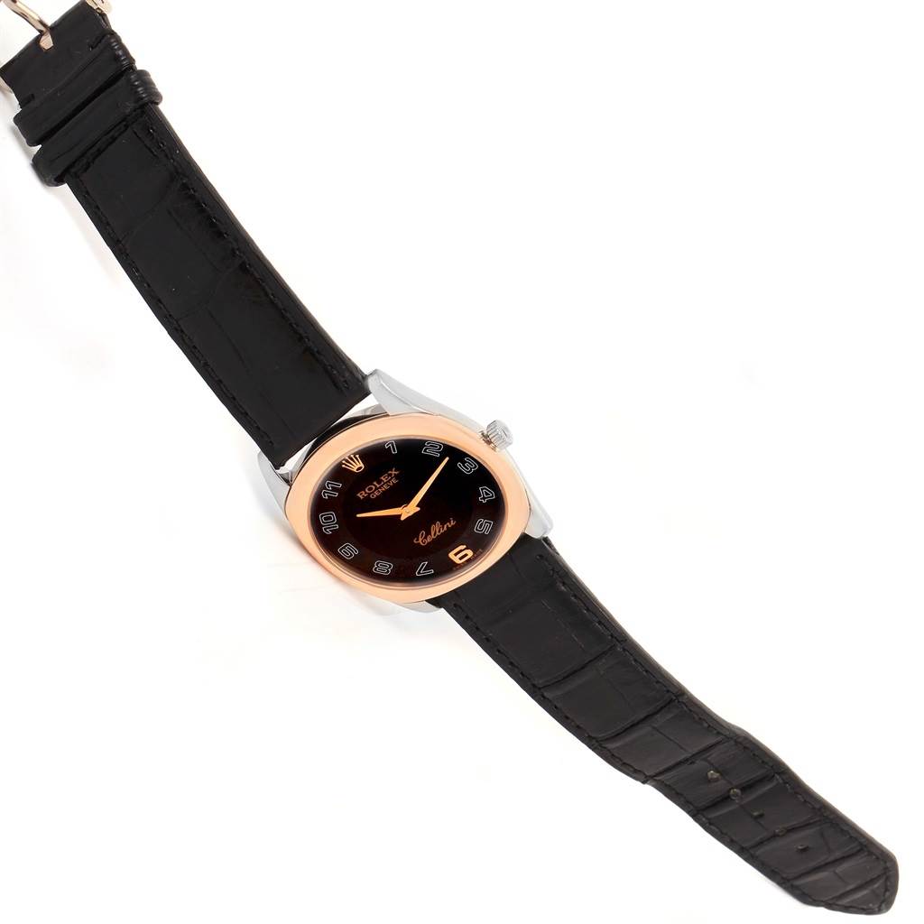 The image shows a Rolex Cellini 4233 Men's White Gold Black Dial 4233 Men's White Gold Black Dial watch from a top-down angle, displaying the black face, gold bezel, and black leather strap.