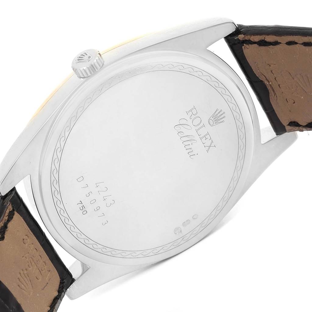The image shows the back case and part of the strap of the Rolex Cellini 4243 Men
s White Gold Black Dial 4243 Men
s White Gold Black Dial watch, with an engraving and crown visible.