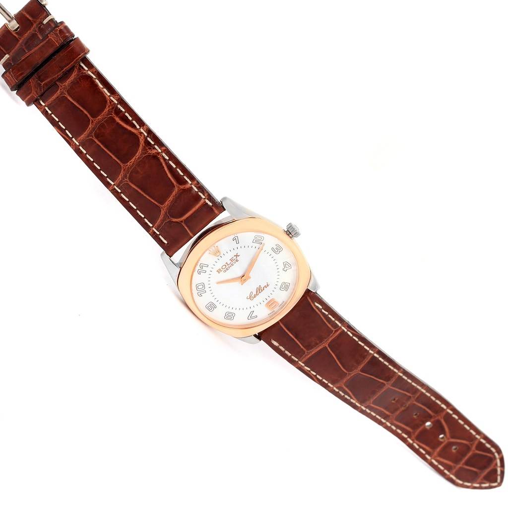 The Rolex Cellini 4233 Men
s White Gold White Dial 4233 Men
s White Gold White Dial watch is shown from a top-down angle, displaying the entire face, case, and leather strap.