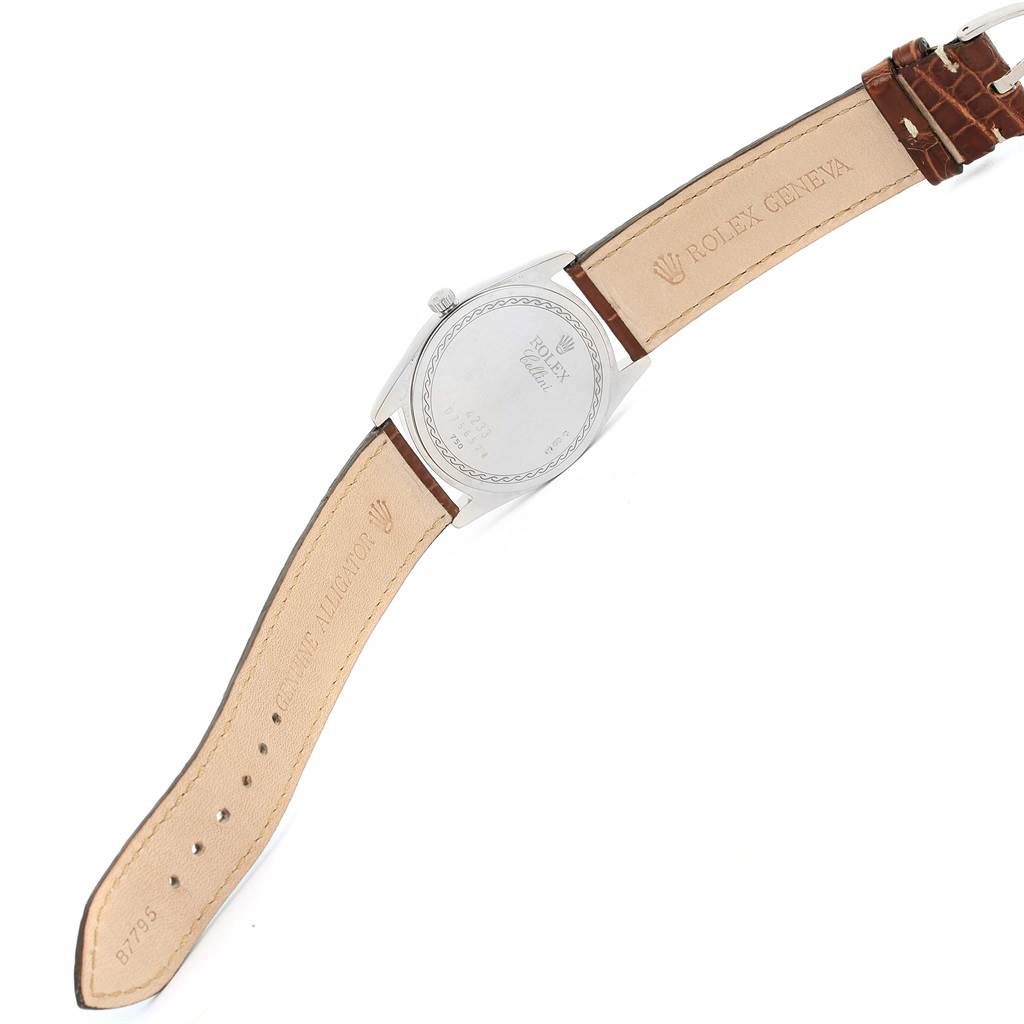 The image shows the back case and leather strap of a Rolex Cellini 4233 Men
s White Gold White Dial 4233 Men
s White Gold White Dial watch, viewed from the rear angle.