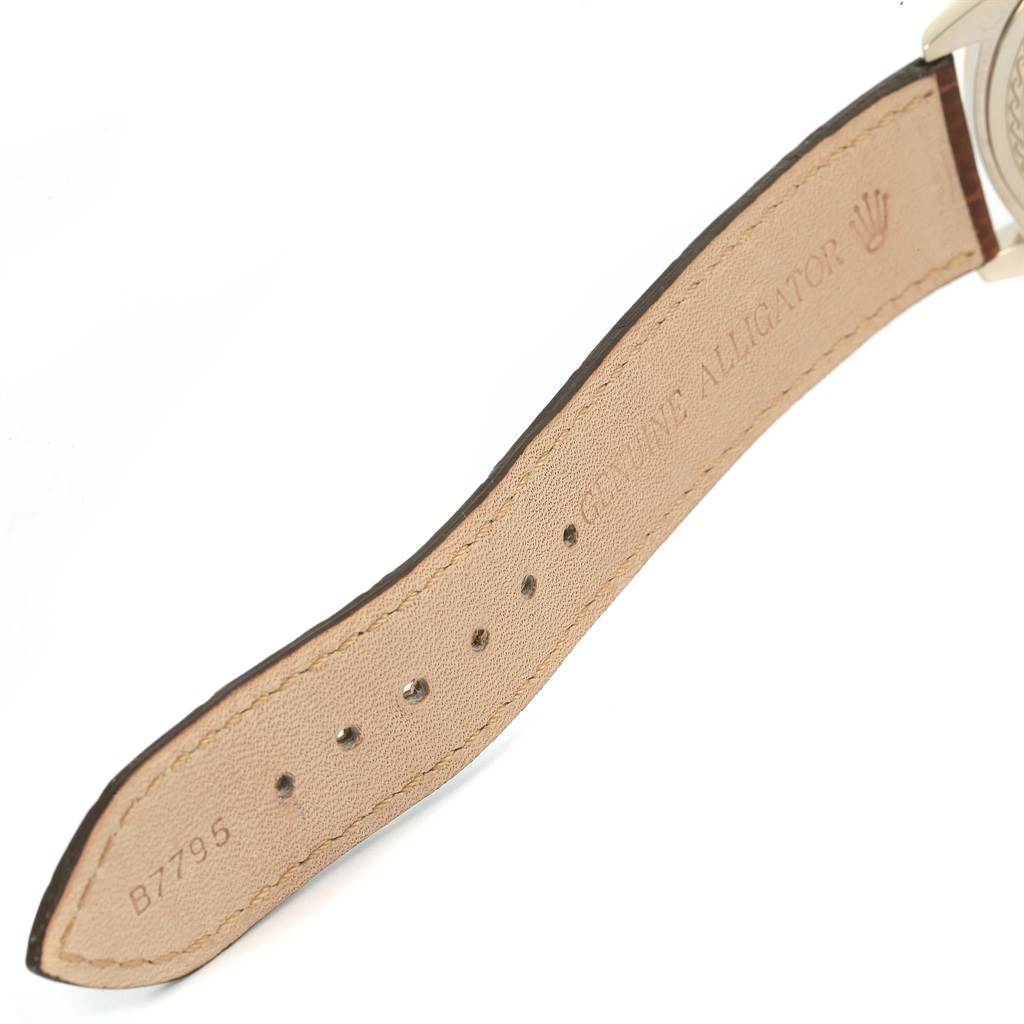 The image shows the leather strap of a Rolex Cellini 4233 Men
s White Gold White Dial 4233 Men
s White Gold White Dial watch, highlighting the genuine alligator stamp and part of the clasp.