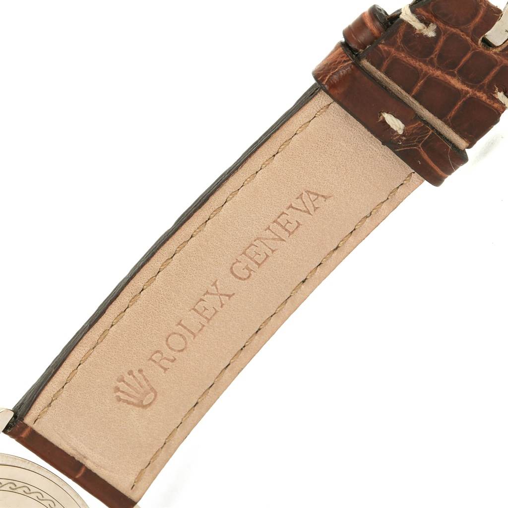The image shows the underside of the leather strap of a Rolex Cellini 4233 Men
s White Gold White Dial 4233 Men
s White Gold White Dial watch, displaying the "Rolex Geneva" inscription.