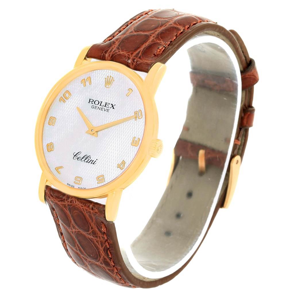 This image shows a side angle of the Rolex Cellini 5115 Men's Yellow Gold Mother of Pearl Dial 5115 Men's Yellow Gold Mother of Pearl Dial watch, highlighting the face, gold casing, and brown leather strap.