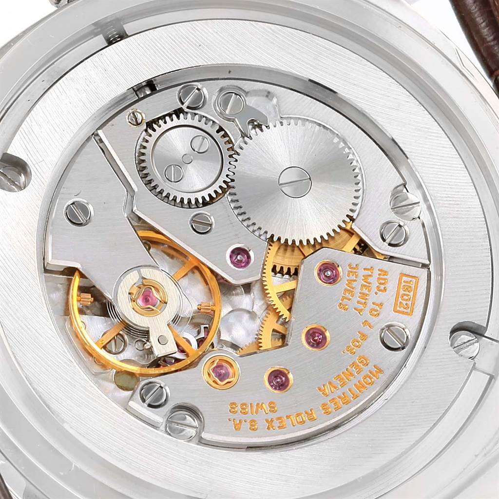 The image shows the internal mechanical movement of a Rolex Cellini 4233 Men
s White Gold Black Dial 4233 Men
s White Gold Black Dial watch from a close-up, rear angle.