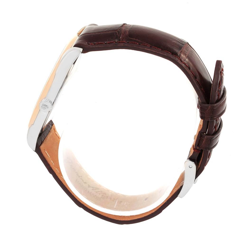 The image displays a side view of a Rolex Cellini 4233 Men
s White Gold Black Dial 4233 Men
s White Gold Black Dial watch, highlighting its bezel, crown, and leather strap.