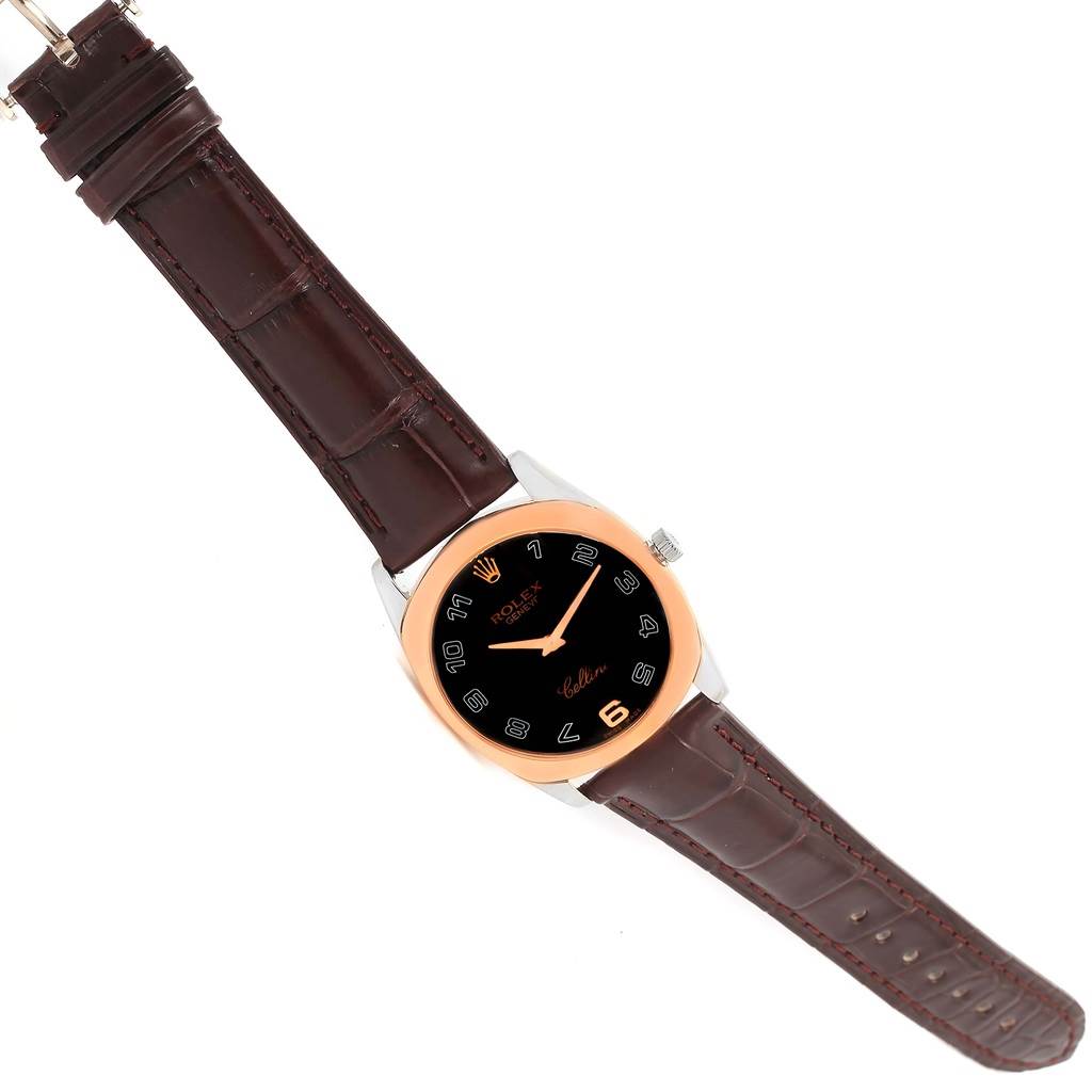 The Rolex Cellini 4233 Men
s White Gold Black Dial 4233 Men
s White Gold Black Dial watch is shown from a top-down angle, displaying its face, bezel, and leather strap.