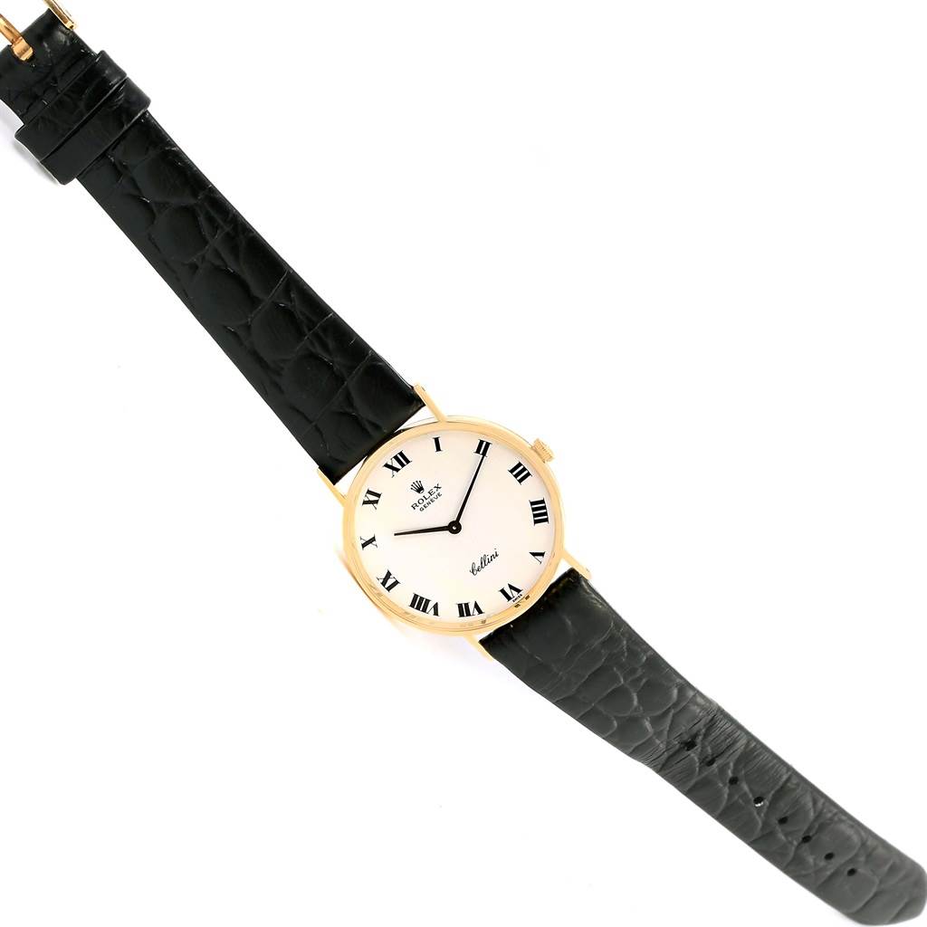 The angle shows the full face and strap of the Rolex Cellini 3833 Yellow Gold White Dial 3833 Yellow Gold White Dial watch, highlighting its black leather strap and gold case.