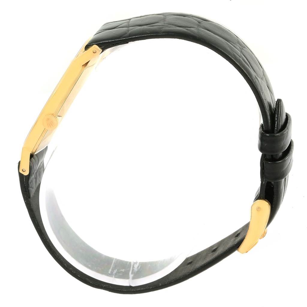 The image shows a side angle and profile view of a Rolex Cellini 3833 Yellow Gold White Dial 3833 Yellow Gold White Dial watch, highlighting its black leather strap and gold case side.