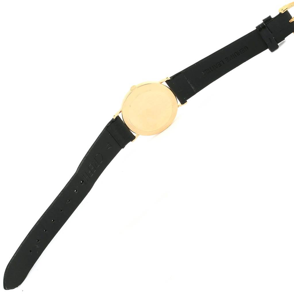 This image shows the back and straps of a Rolex Cellini 3833 Yellow Gold White Dial 3833 Yellow Gold White Dial watch from a top-down angle.