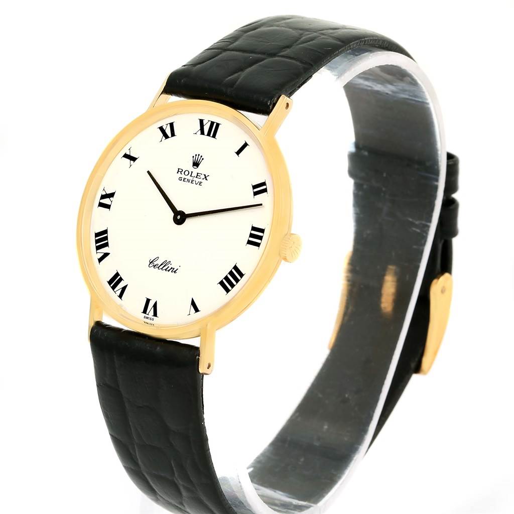 The Rolex Cellini 3833 Yellow Gold White Dial 3833 Yellow Gold White Dial model watch is shown from a three-quarter angle, displaying the face, case, and strap.