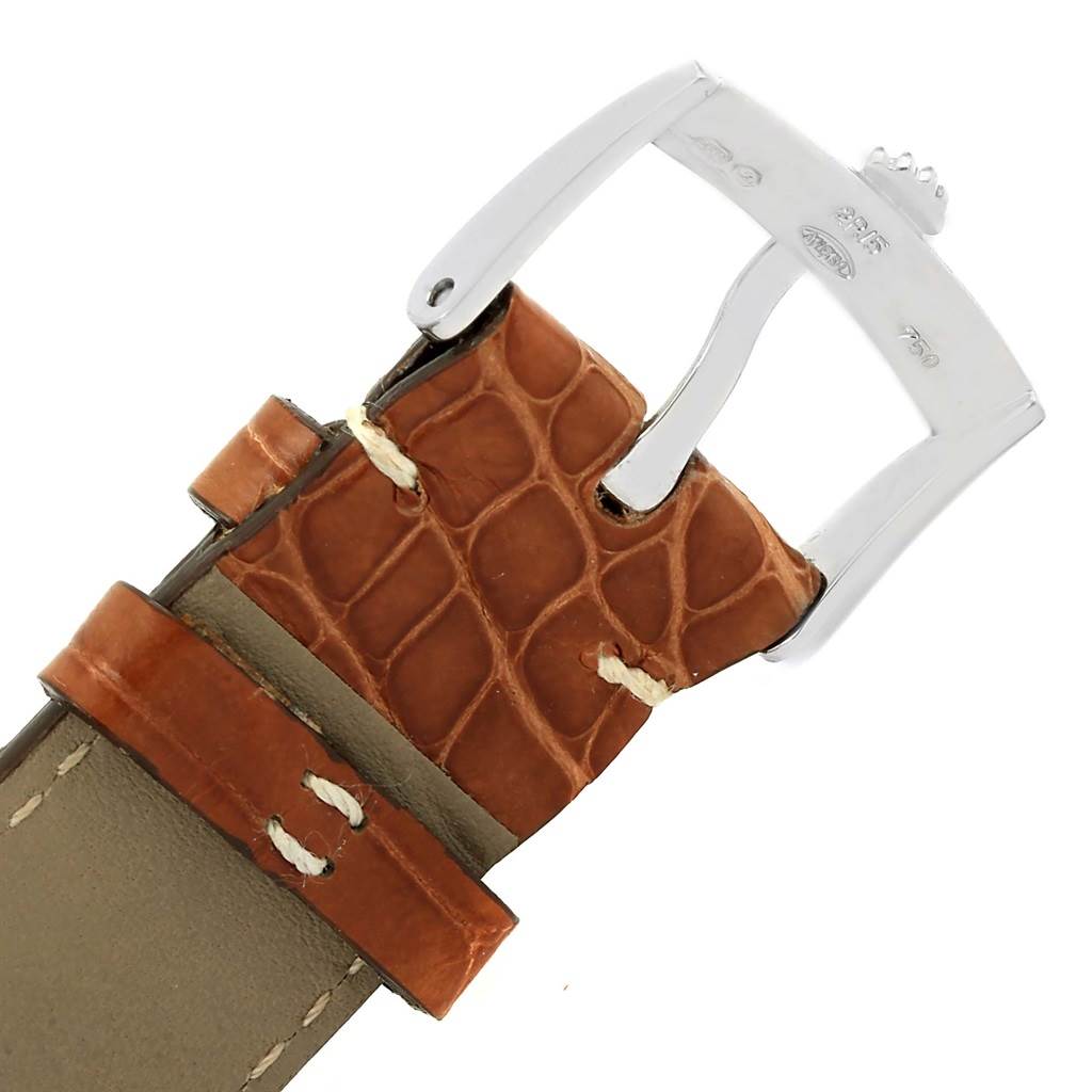 This image shows a close-up of the buckle and part of the leather strap of a Rolex Cellini 4233 Men
s White Gold Black Dial 4233 Men
s White Gold Black Dial watch.