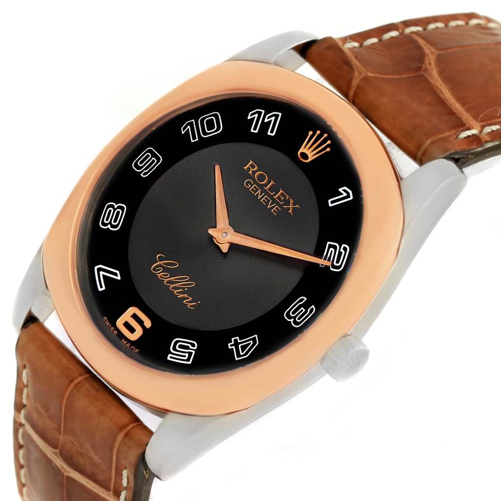 This Rolex Cellini 4233 Men
s White Gold Black Dial 4233 Men
s White Gold Black Dial watch is shown at an angled view, highlighting its dial, rose gold case, and brown leather strap.