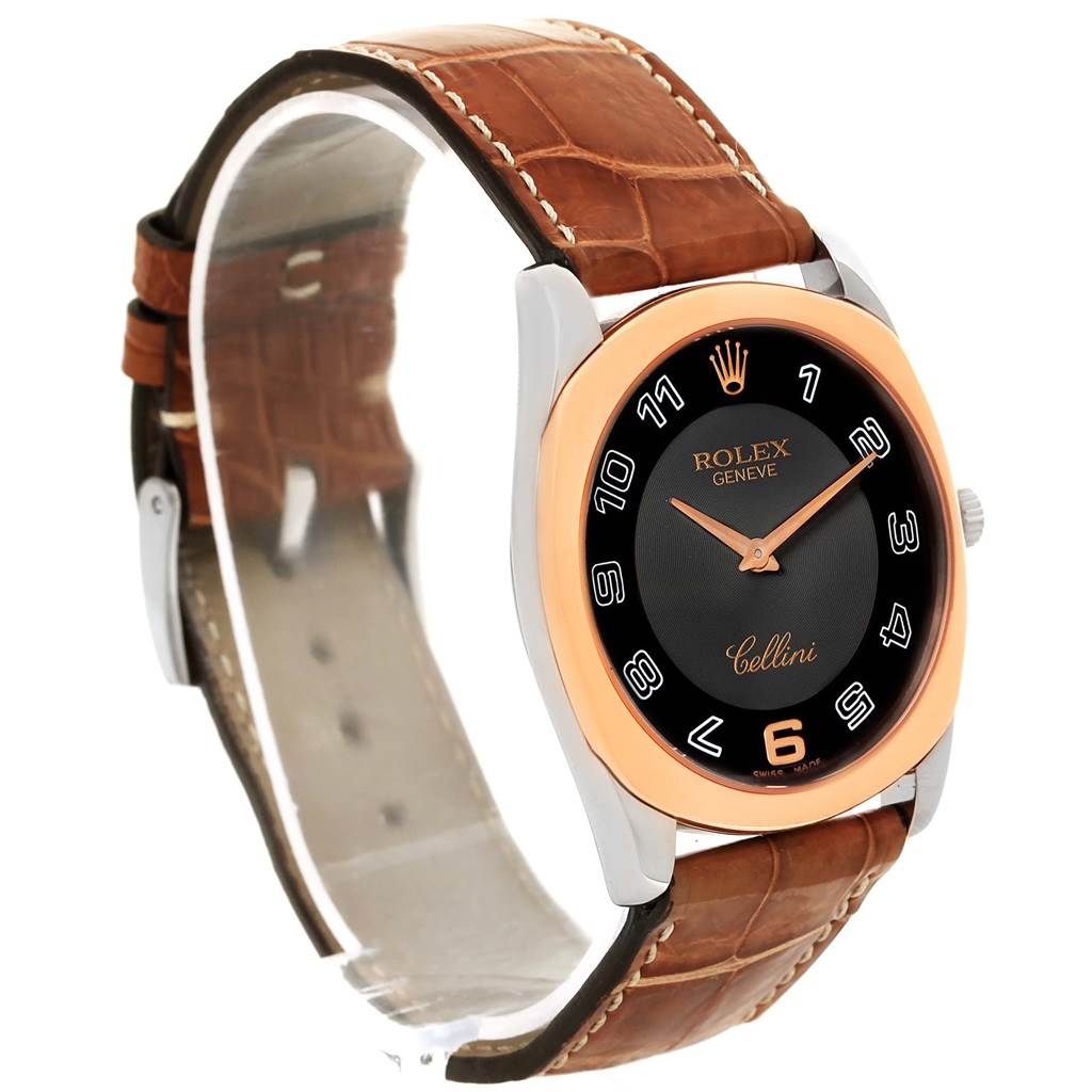 This image shows a Rolex Cellini 4233 Men
s White Gold Black Dial 4233 Men
s White Gold Black Dial watch at a side angle, highlighting its leather strap, gold bezel, and black dial.