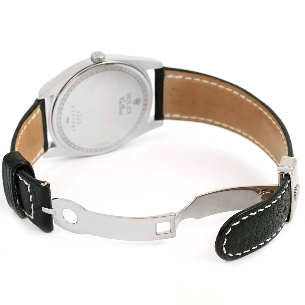 The image shows the back and inside of the strap of a Rolex Cellini 4243 Men's White Gold White Dial 4243 Men's White Gold White Dial watch, featuring the case back, leather strap, and clasp.