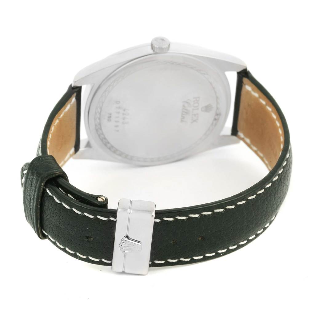 The image shows the back of the Rolex Cellini 4243 Men's White Gold White Dial 4243 Men's White Gold White Dial watch, highlighting the clasp and green leather strap with white stitching.