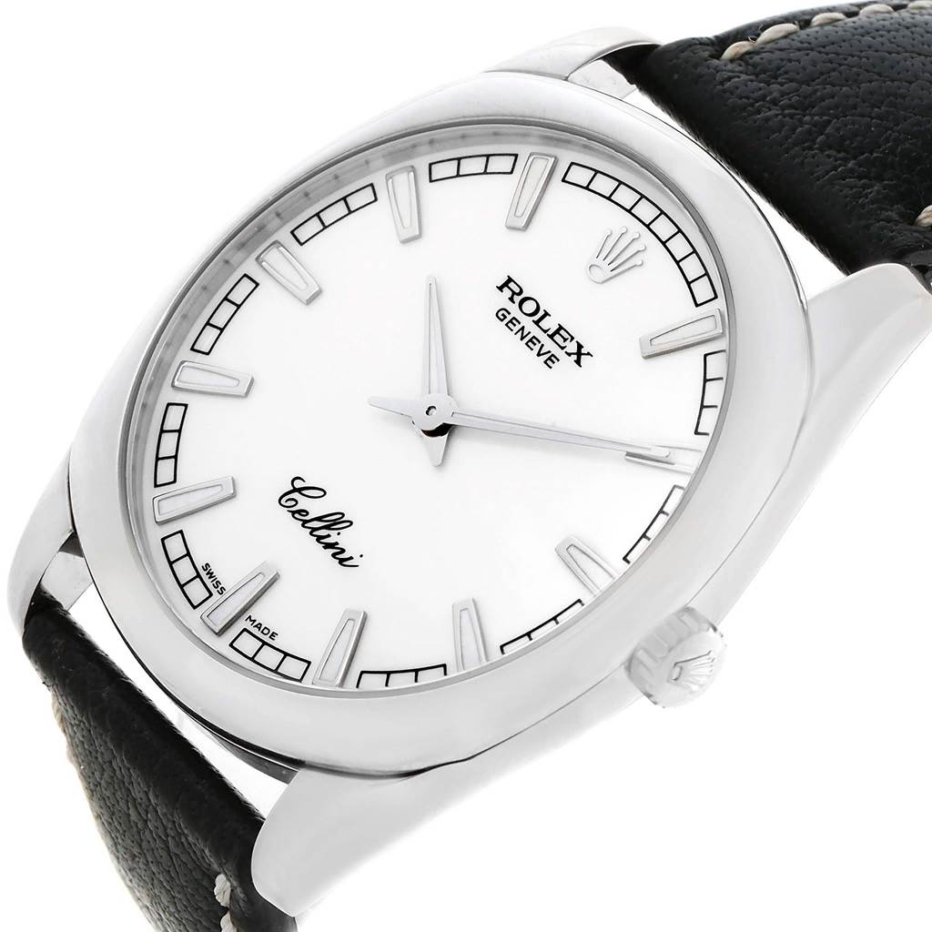 The image shows a close-up of a Rolex Cellini 4243 Men's White Gold White Dial 4243 Men's White Gold White Dial watch, featuring its face, hour markers, hands, bezel, and part of its black leather strap.