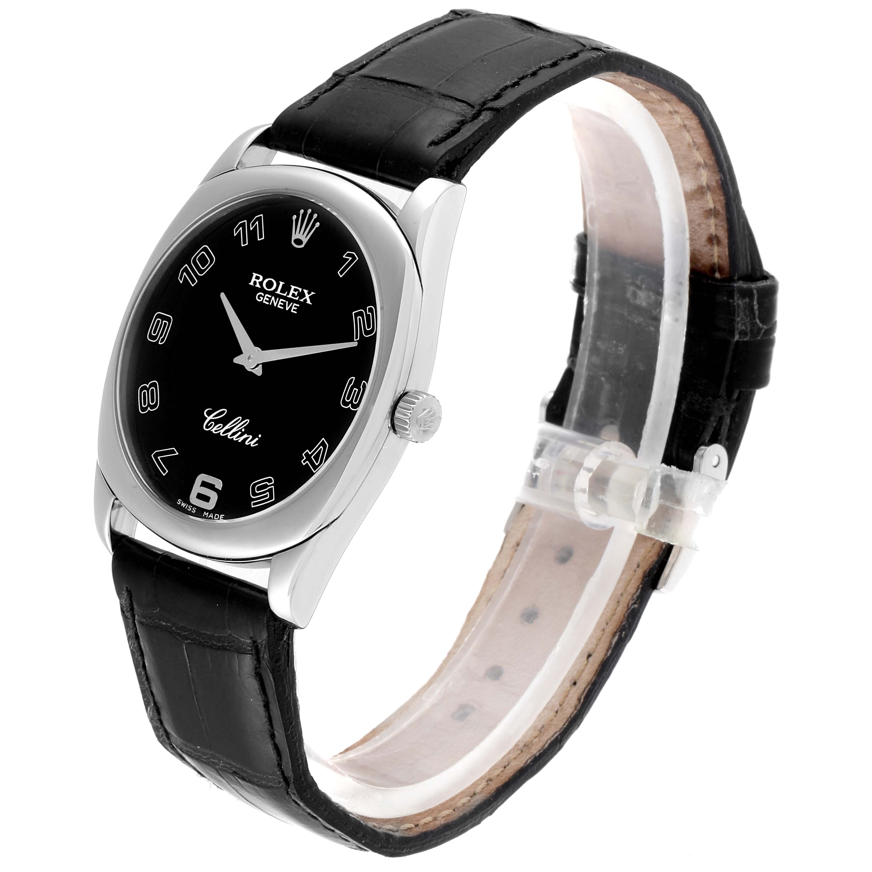 The Rolex Cellini 4233 Men
s White Gold Black Dial 4233 Men
s White Gold Black Dial watch is shown at a slight tilt, displaying its black dial, silver case, crown, and black leather strap.