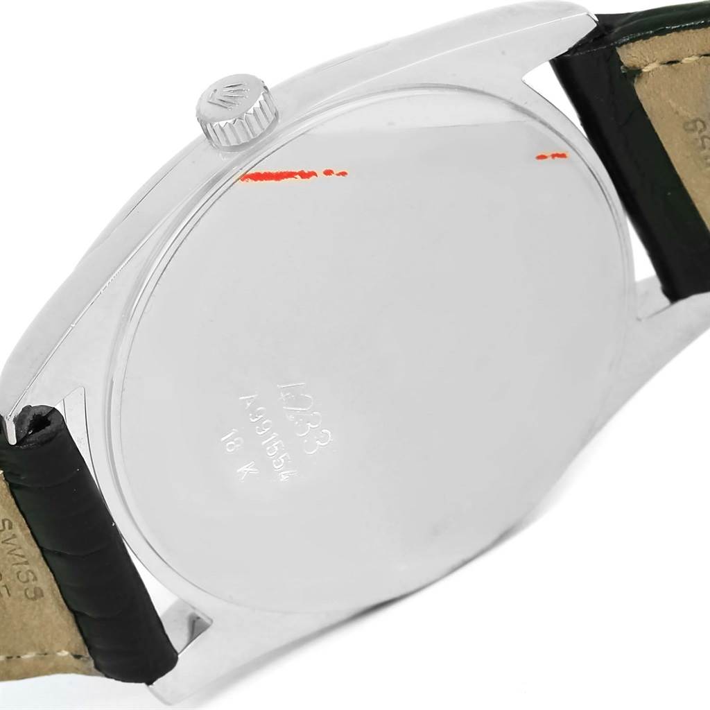 The image shows the back case and crown of a Rolex Cellini 4233 Men's White Gold Black Dial 4233 Men's White Gold Black Dial watch from a side angle.