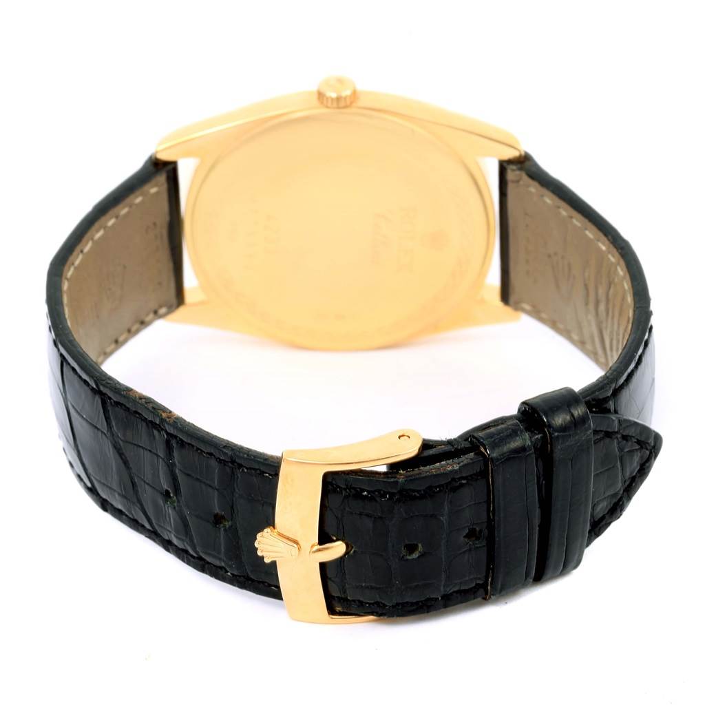 The image shows the back view of a Rolex Cellini 4233 Men's Yellow Gold White Dial 4233 Men's Yellow Gold White Dial watch, including its black leather strap and gold buckle.
