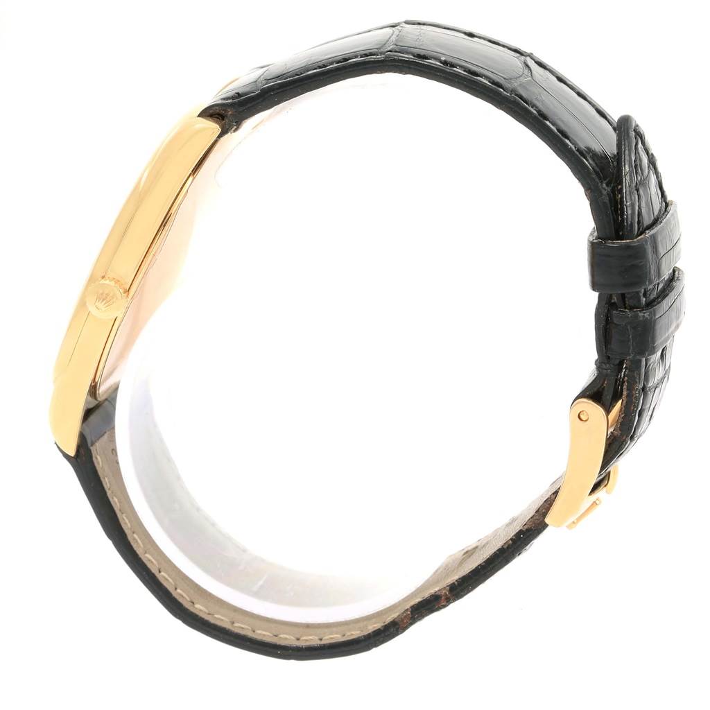 The image shows a side view of the Rolex Cellini 4233 Men's Yellow Gold White Dial 4233 Men's Yellow Gold White Dial watch, highlighting its gold case, crown, and black leather strap.