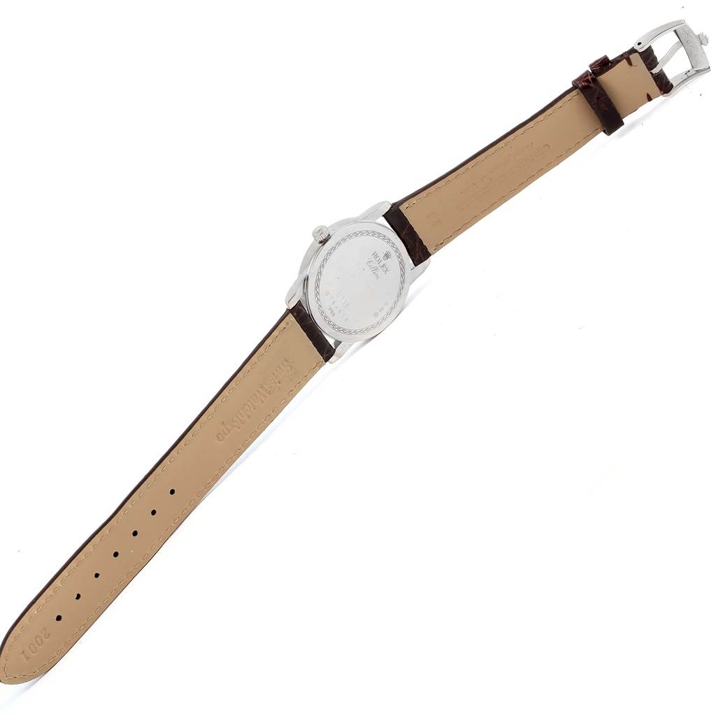 This image shows the back view of the Rolex Cellini 5116 White Gold Silver Dial 5116 White Gold Silver Dial watch, displaying its case, crown, and leather strap with its buckle.