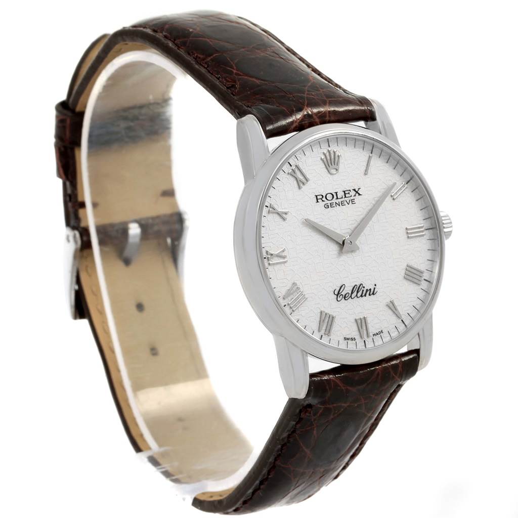 This image shows a Rolex Cellini 5116 White Gold Silver Dial 5116 White Gold Silver Dial watch from a side angle, highlighting its face, leather strap, and case.