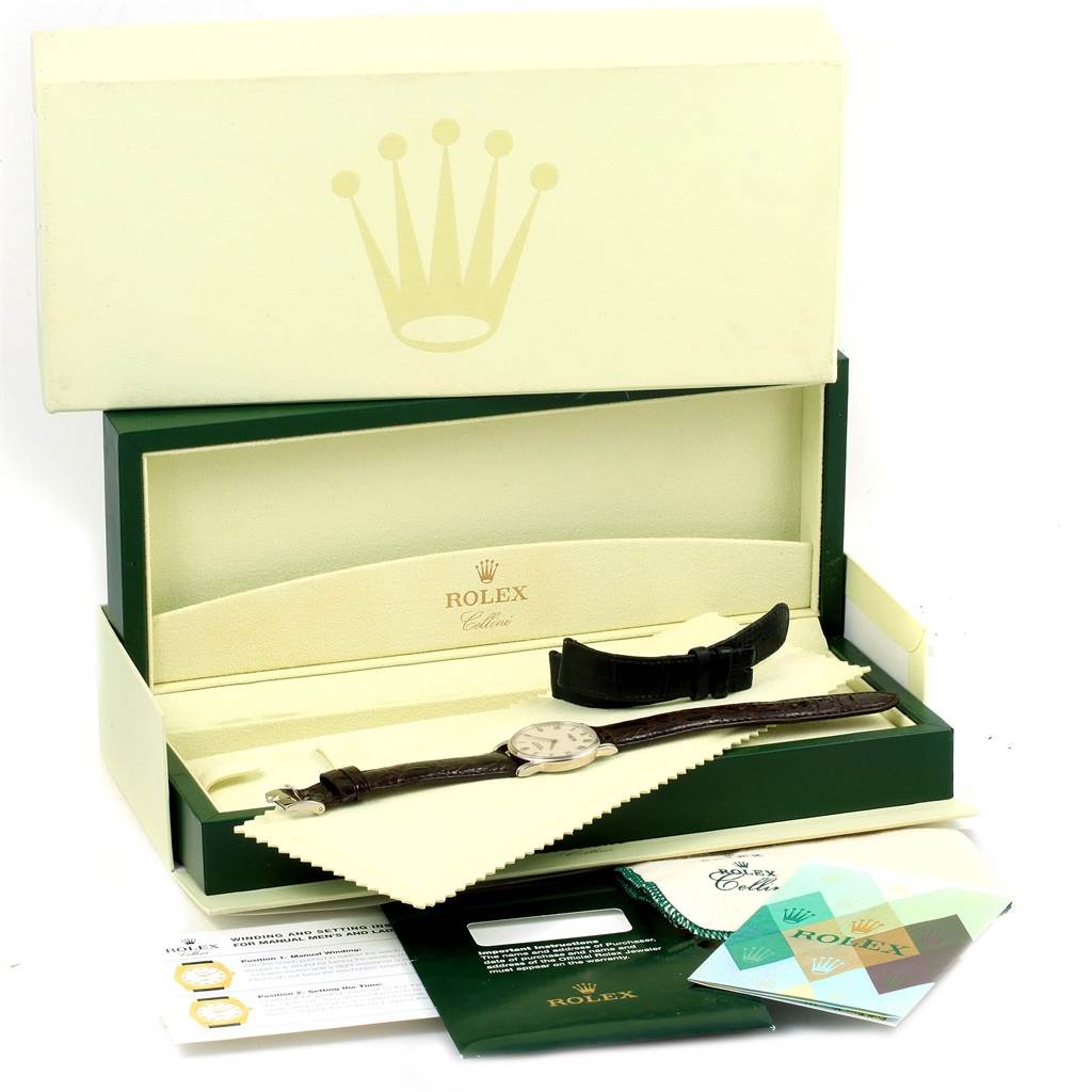 The image shows a Rolex Cellini 5116 White Gold Silver Dial 5116 White Gold Silver Dial watch with its box, extra strap, cleaning cloth, and accompanying paperwork, viewed from above.