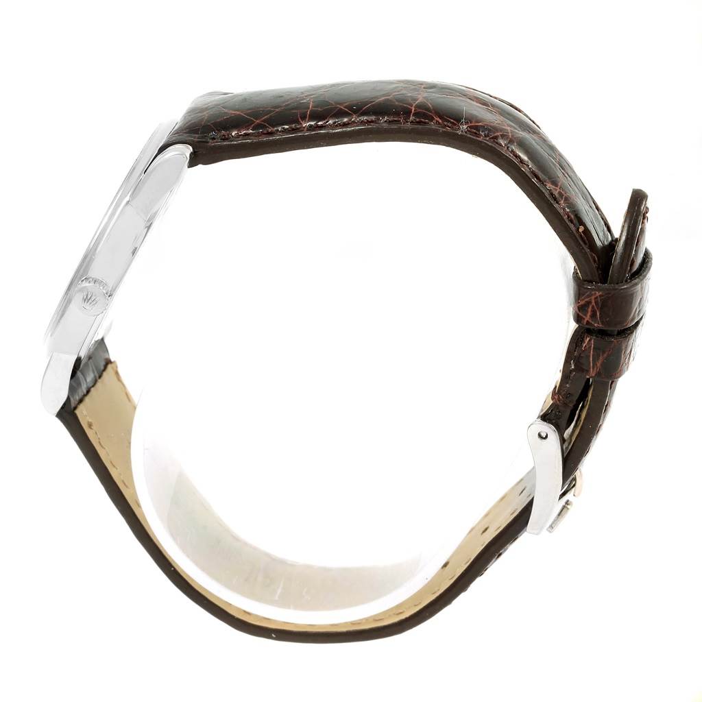 The image shows a side view of a Rolex Cellini 5116 White Gold Silver Dial 5116 White Gold Silver Dial watch, focusing on the leather strap and side of the case.