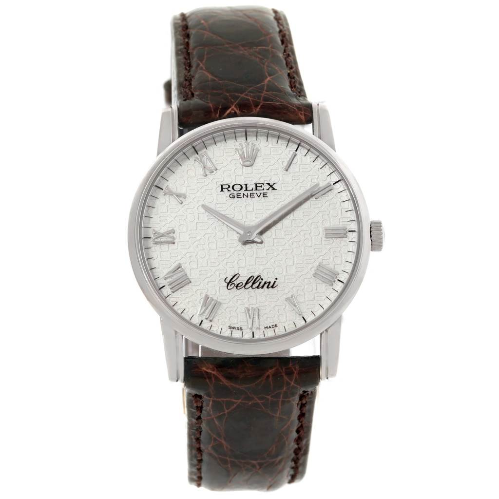 The Rolex Cellini 5116 White Gold Silver Dial 5116 White Gold Silver Dial watch is shown from a front angle, displaying its face, Roman numeral markers, and leather strap.