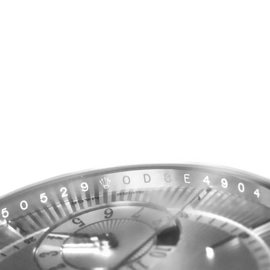 The image shows a close-up of the dial and part of the bezel of a Rolex Cellini 50529 Men
s White Gold Silver Dial 50529 Men
s White Gold Silver Dial watch.