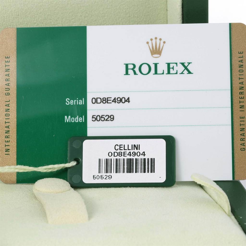 The image shows a close-up of the Rolex Cellini 50529 Men
s White Gold Silver Dial 50529 Men
s White Gold Silver Dial model 50529 serial card and tag.