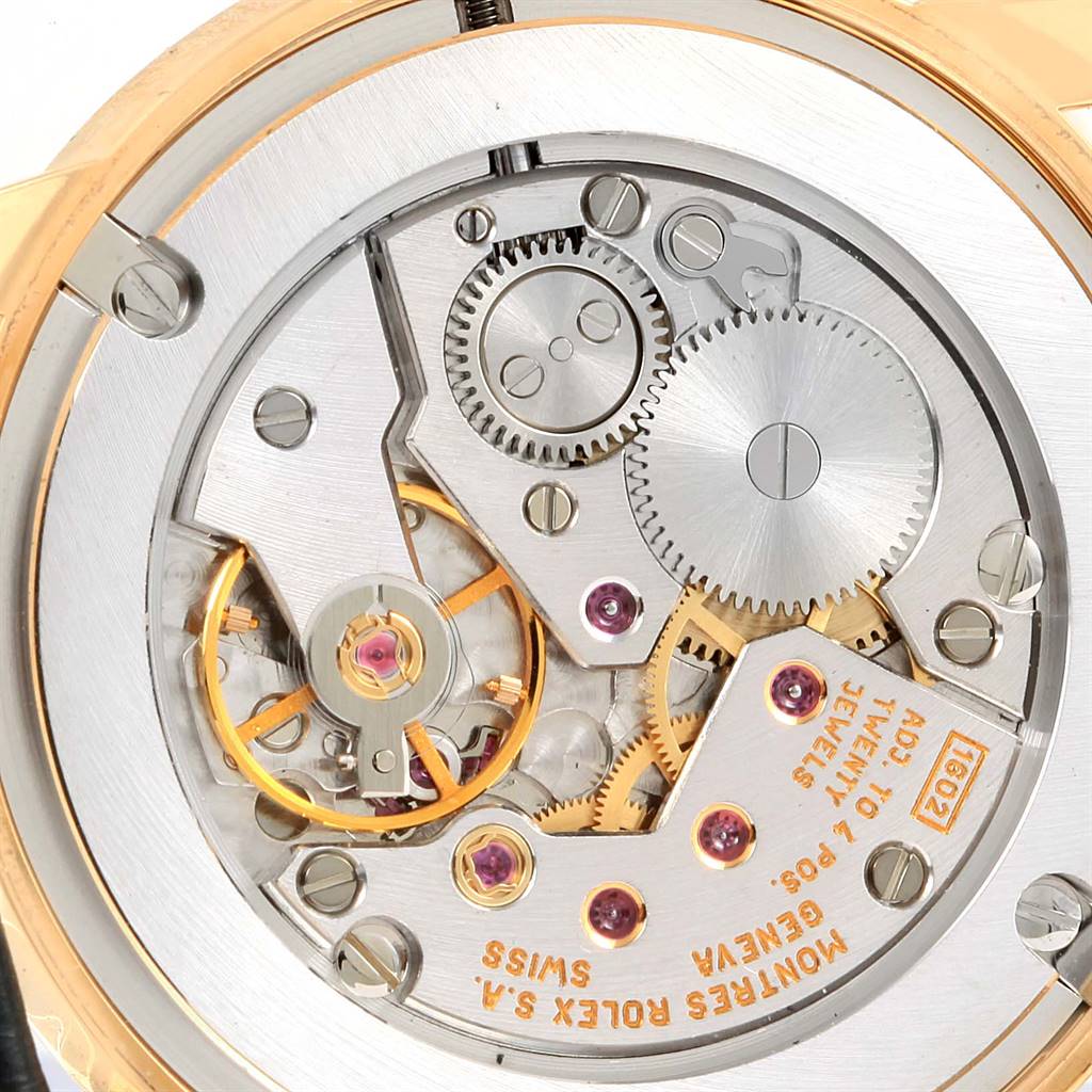 The image shows the movement and intricate inner mechanics of the Rolex Cellini 5116 Yellow Gold Grey Dial 5116 Yellow Gold Grey Dial watch, viewed from the back.