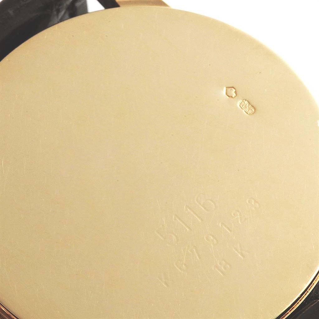 This image shows the back casing of a Rolex Cellini 5116 Yellow Gold Grey Dial 5116 Yellow Gold Grey Dial model watch, featuring engravings and hallmarks.