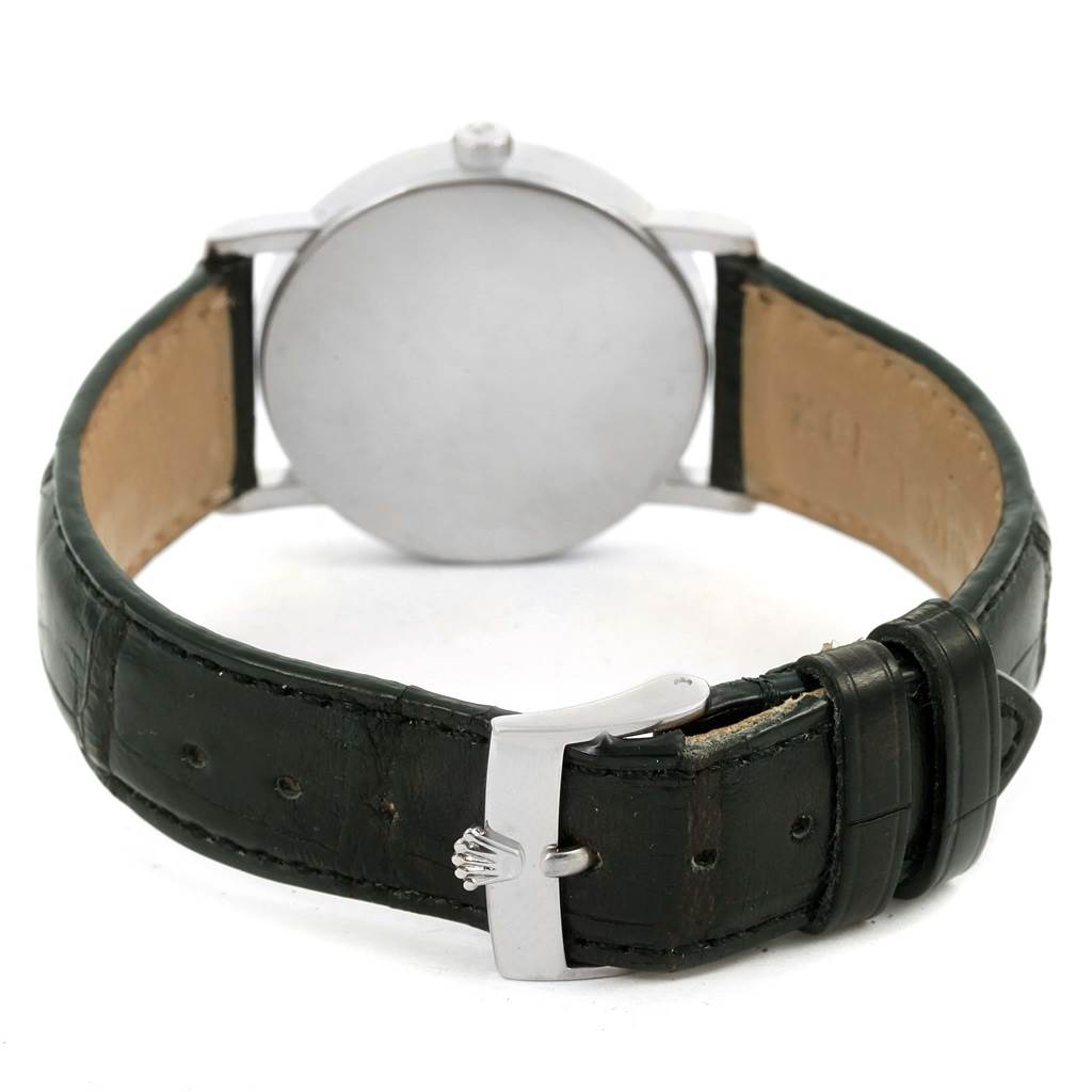 The image shows the back of a Rolex Cellini 5115 White Gold Black Dial 5115 White Gold Black Dial watch, including its leather strap and buckle.