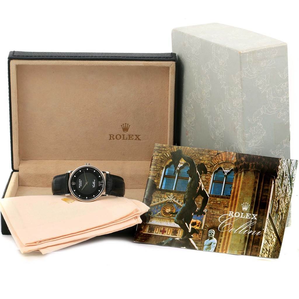 The image shows a Rolex Cellini 5115 White Gold Black Dial 5115 White Gold Black Dial watch in its case, with accompanying documentation and a microfiber cloth.