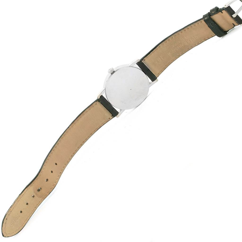 The Rolex Cellini 5115 White Gold Black Dial 5115 White Gold Black Dial watch is shown from the back, displaying the case back and both sides of the leather strap.