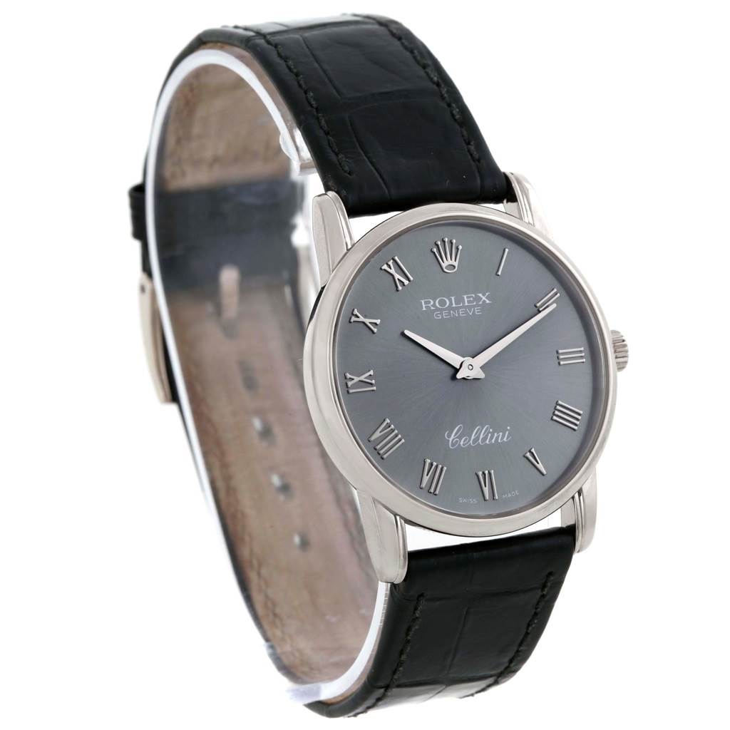 This image shows a Rolex Cellini 5116 Men's White Gold Grey Dial 5116 Men's White Gold Grey Dial watch from an angled side view, highlighting its face, Roman numeral markers, and black leather strap.